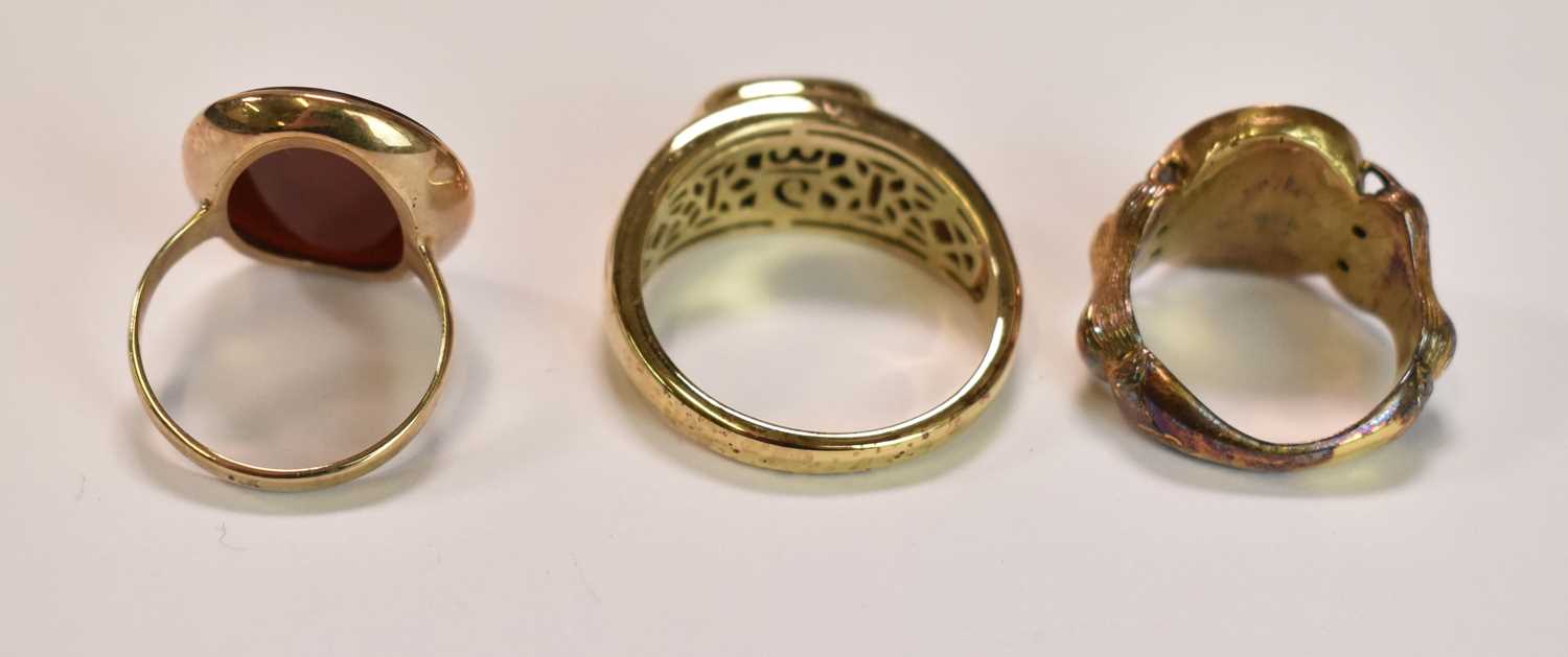 Three yellow metal rings, one set with a carved carnelian, size O, 4.9g approx one with central - Image 3 of 6