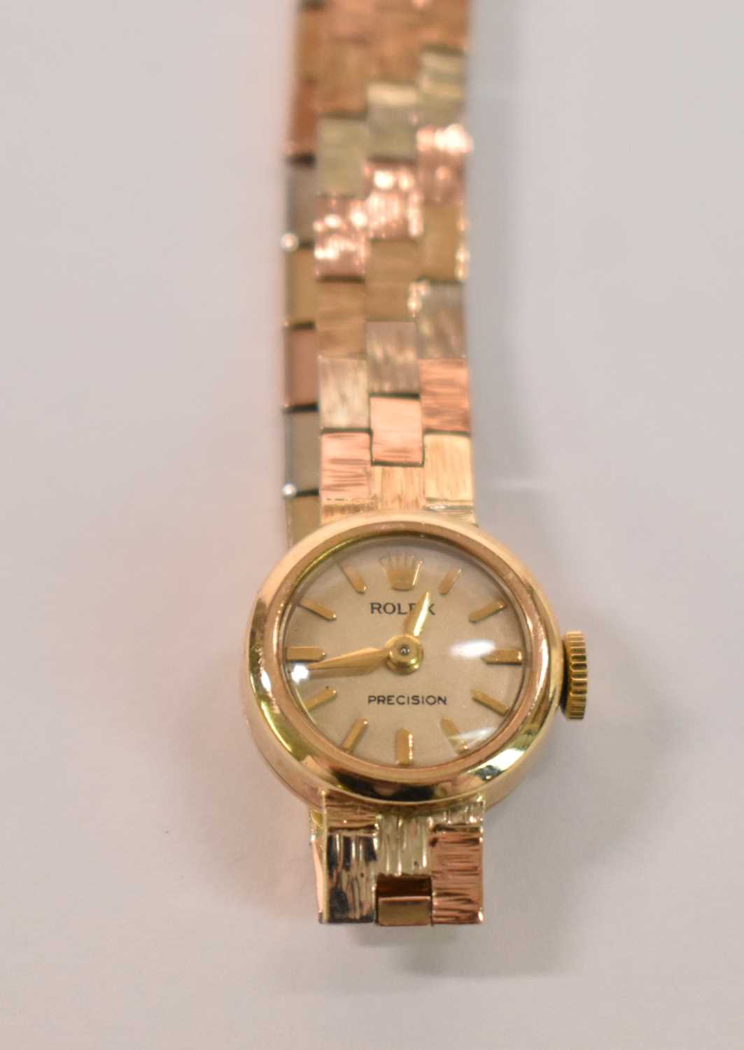 ROLEX; a lady's 9ct yellow gold wristwatch with tricolour bracelet and engraved inscription to