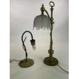 Two decorative brass table lamps, one adjustable with a frosted glass shade and the other with a