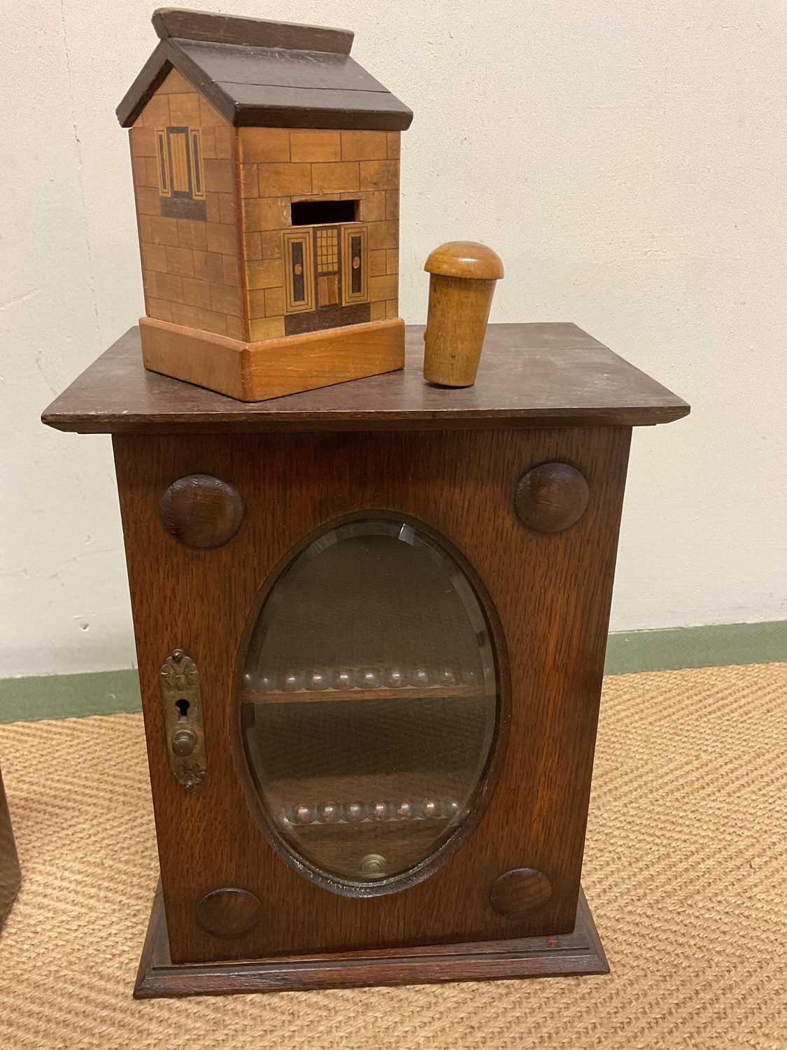 An oak smoker's cabinet with glass drawer to base, a green puzzle money box in the form of a - Image 2 of 4