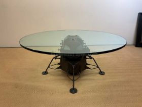 SIR PATRICK MOORE CBE HON FRS FRAS (1923-2012); a bronze 'Apollo' table by Mark Stoddart, with glass