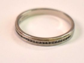 A platinum and diamond wedding ring, size O, approx. 3.95g.