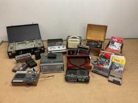 A collection of vintage reel to reel recorders, record players, portable cassette players and