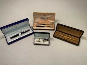 A collectors' lot comprising a boxed Waterman pen, a boxed Parker pen, a boxed Parker 61 set of a