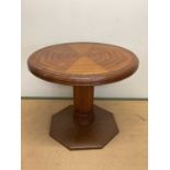 A Danish Arts and Crafts centre table with a octagonal hammered and riveted copper base with