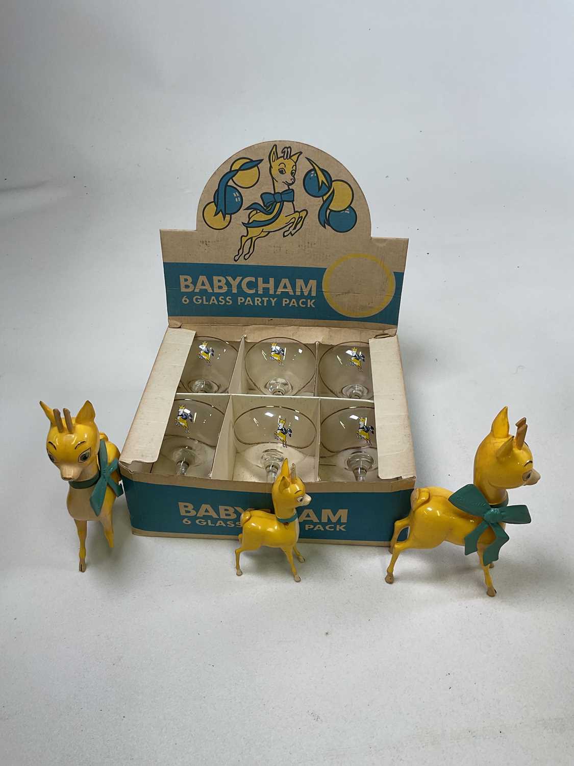 BABYCHAM; a boxed six glass party pack, also three Babycham plastic figures (one af).