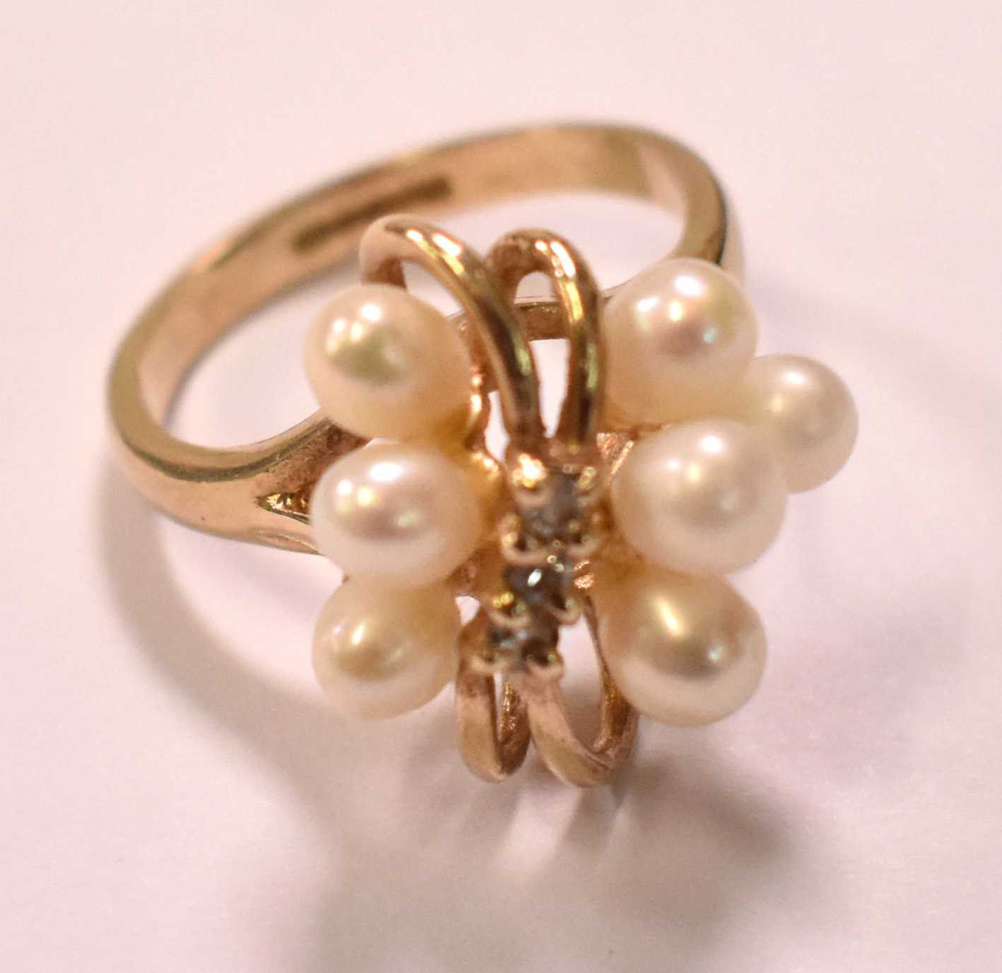 A 9ct yellow gold cultured pearl set ring, size H 1/2, and a 9ct yellow gold small band, size G 1/2,