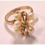 A 9ct yellow gold cultured pearl set ring, size H 1/2, and a 9ct yellow gold small band, size G 1/2,