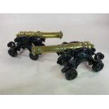A large pair of Victorian table cannon, each with turned gunmetal barrels and on elaborate