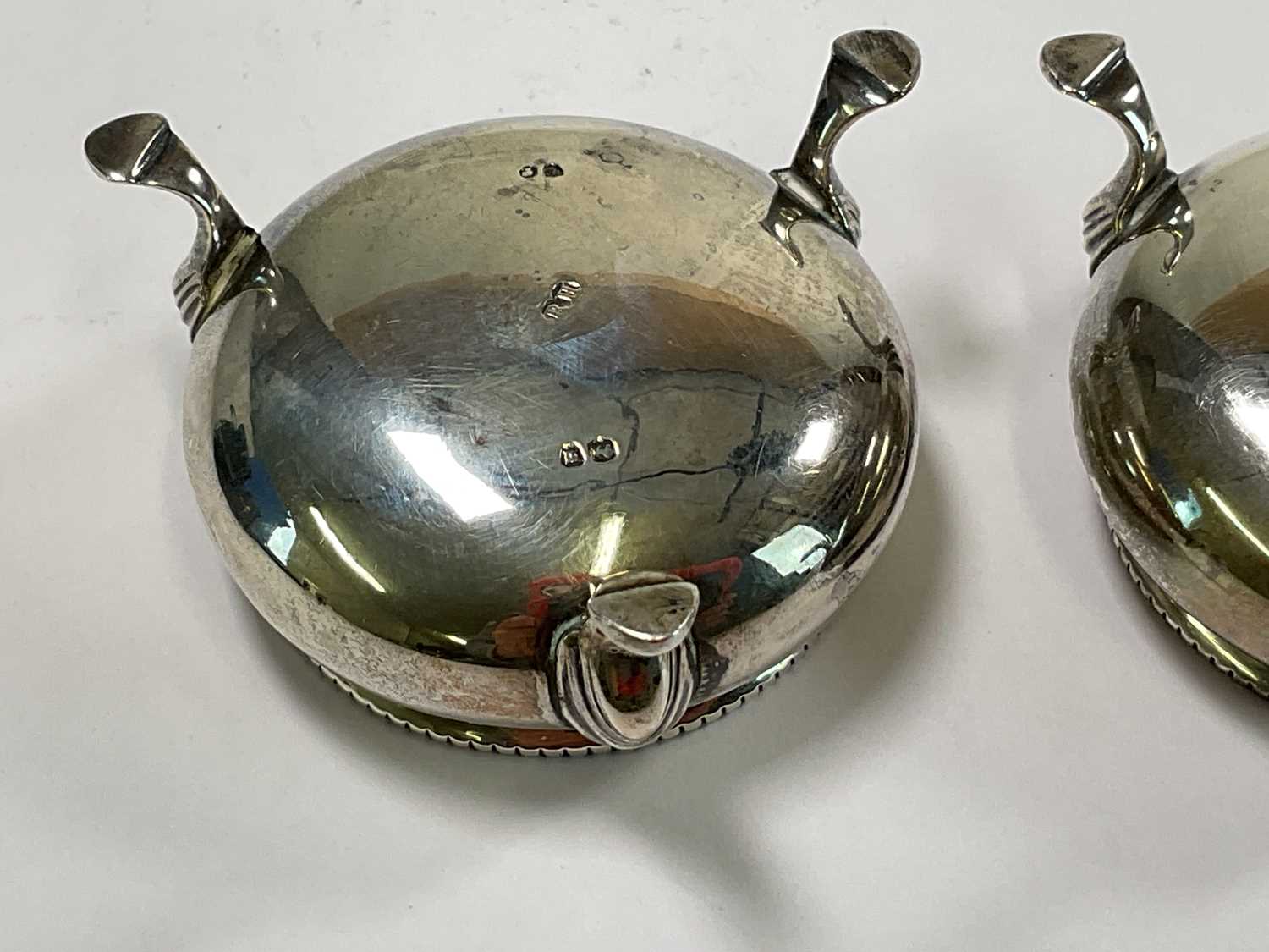 ROBERT HENNELL; a pair of Victorian hallmarked silver open salts raised on three scrolling supports, - Image 2 of 4