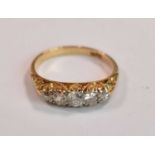 An 18ct yellow gold five stone graduated diamond ring, the central diamond weighing approx 0.20ct (