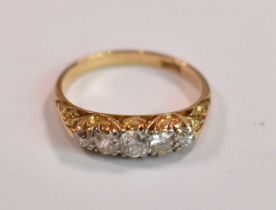 An 18ct yellow gold five stone graduated diamond ring, the central diamond weighing approx 0.20ct (
