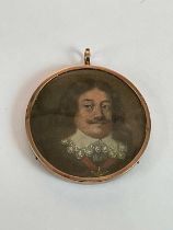 X A circular portrait miniature, possibly 17th century Dutch, study of a gentleman with moustache