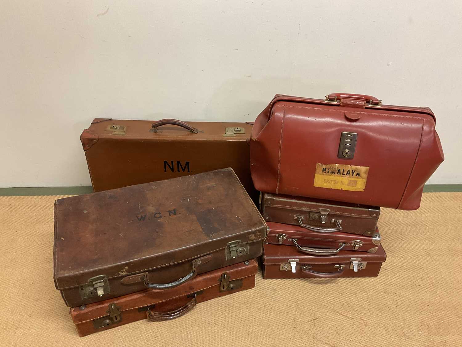 A collection of vintage suitcases (7 )