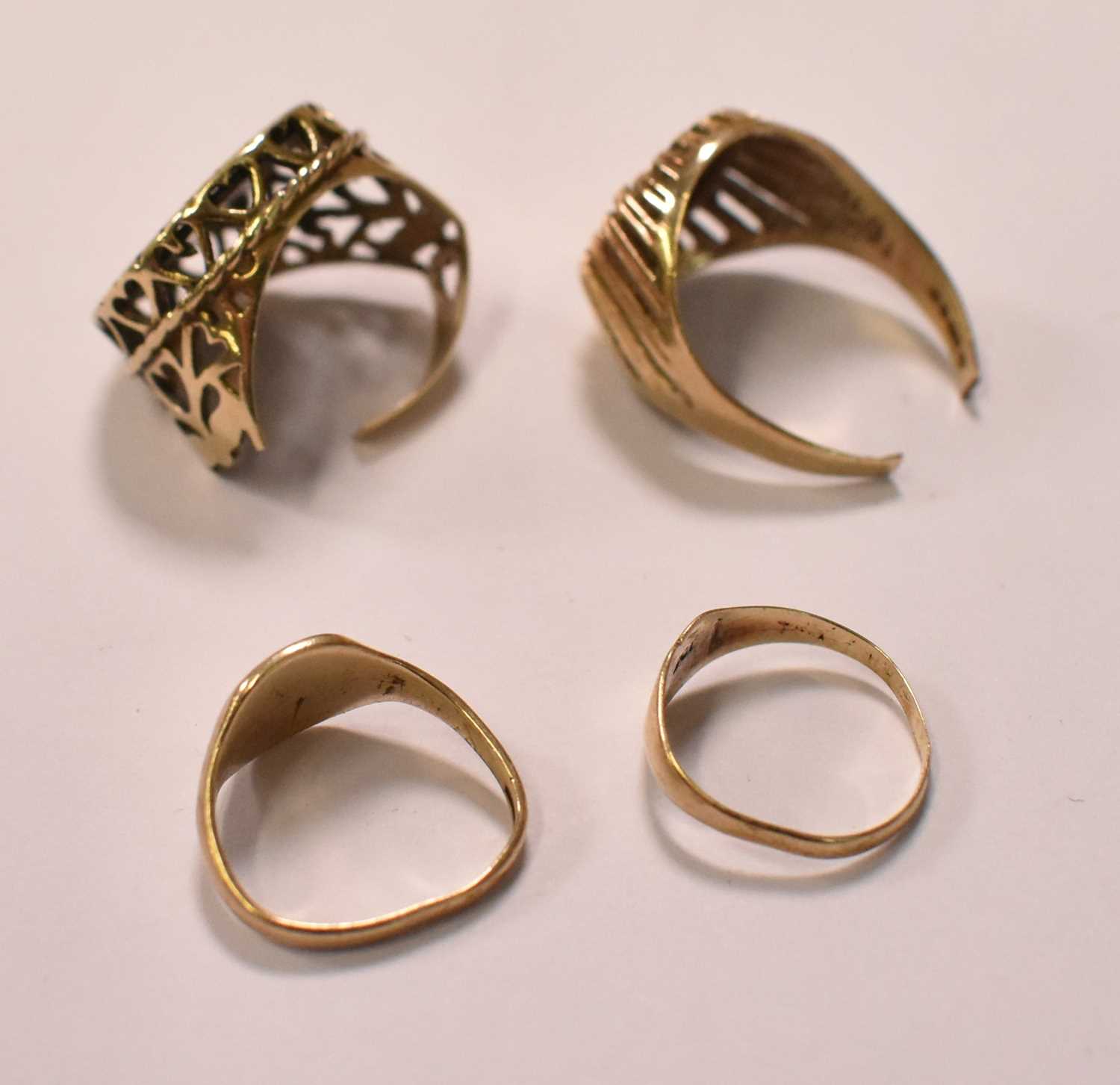 Four damaged yellow gold rings, two set with imitation 'coins', combined approx 7.6g (two badly - Image 2 of 3