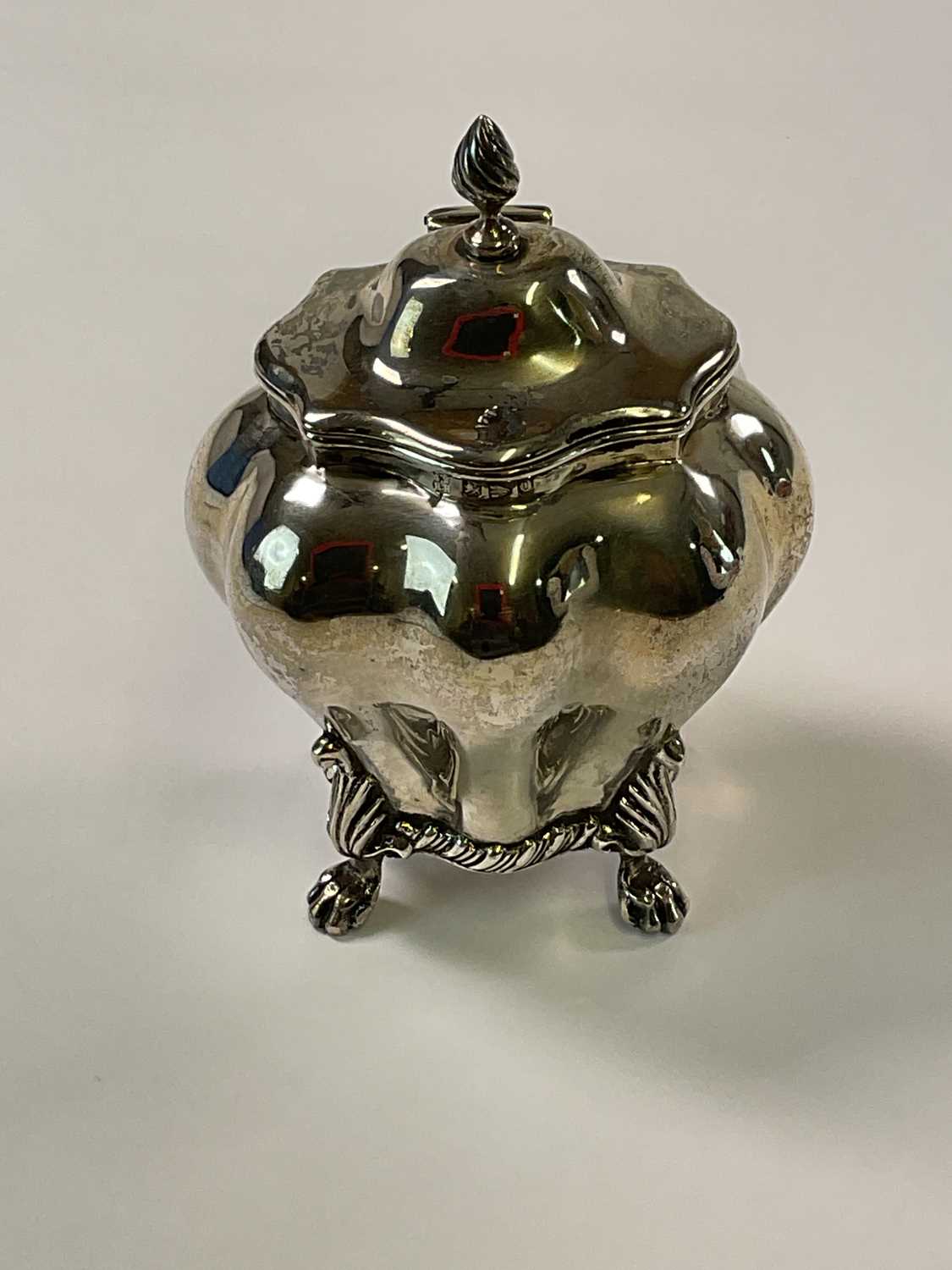 NATHAN & HAYES; a late Victorian hallmarked silver tea caddy of bombe outline with hinged lid and