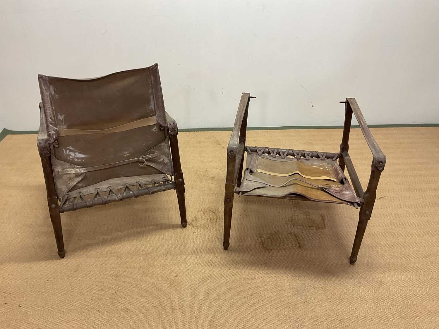 A pair of mid 20th century safari chairs constructed of leather and stained beech. Condition Report: - Image 2 of 2