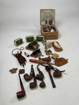 A group of collectors' items including sewing accoutrements, pipes, old tins of tobacco, a lighter