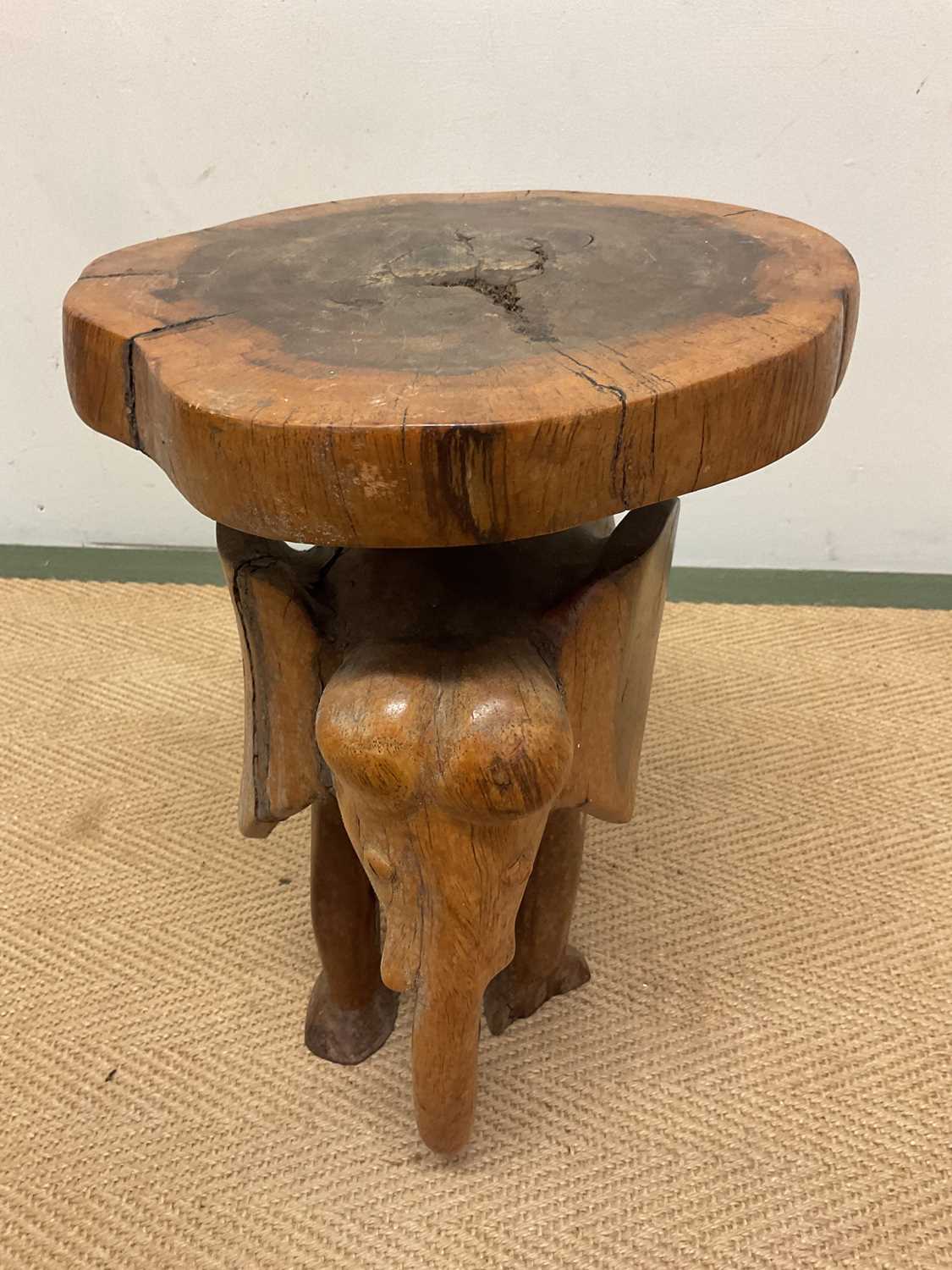A carved wooden elephant stand, height 39cm, diameter 30cm. - Image 2 of 5