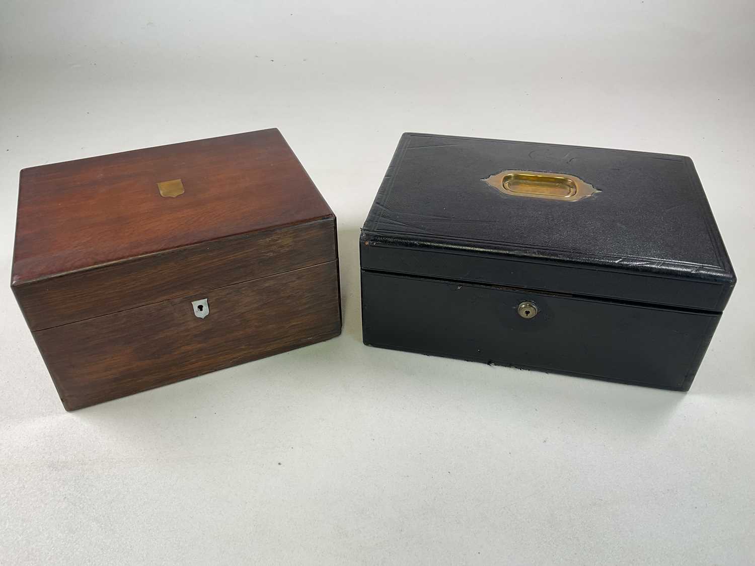 A leather covered jewellery box with tray to interior, 15 x 36 x 25cm, with key, and a wooden travel