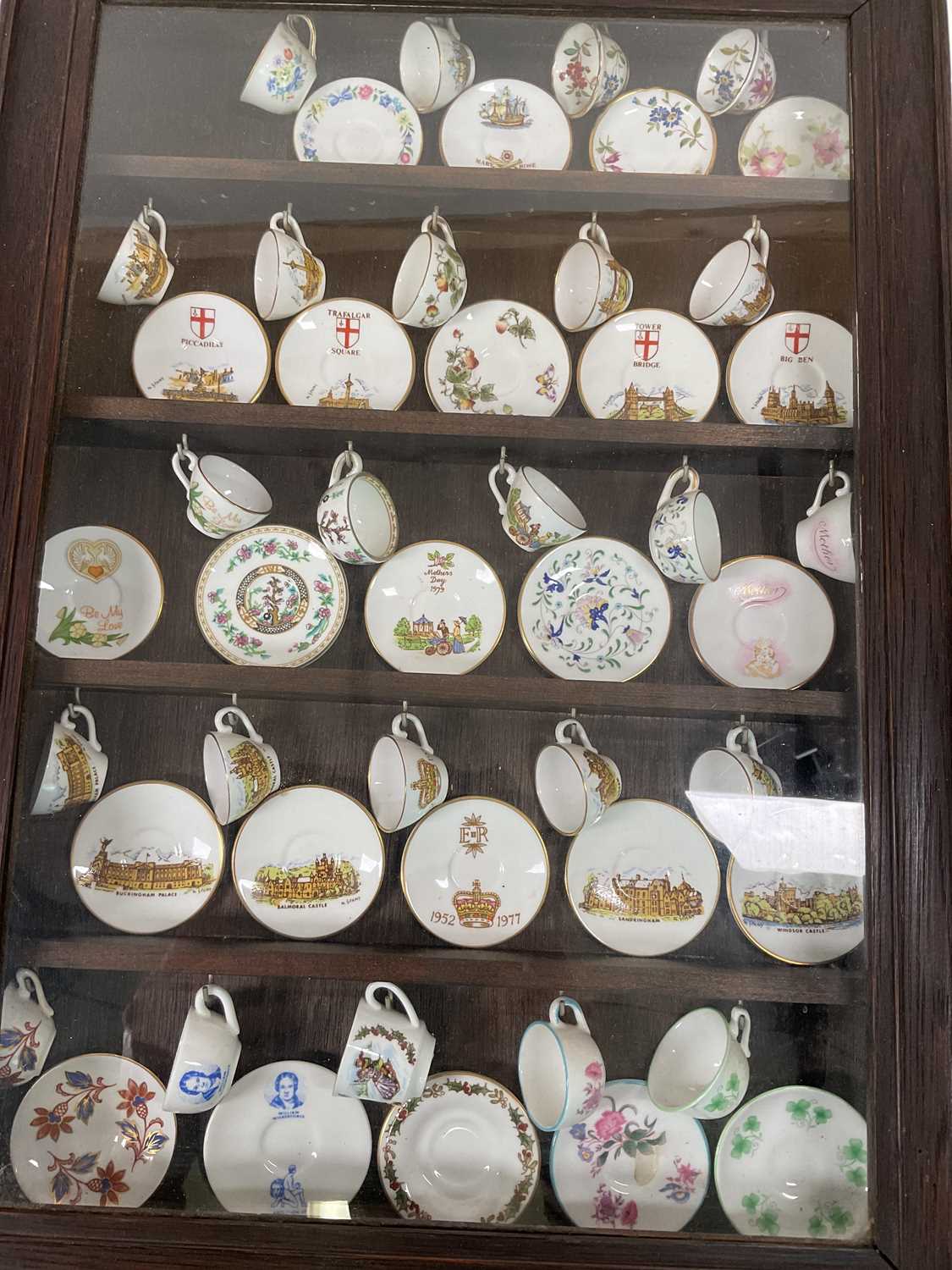 A collection of mainly miniature ceramics including cups and saucers, thimbles, bells and cat - Image 4 of 8