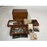 A wooden box containing British and foreign coinage, boxed Maundy coins, two Lusitania boxed replica