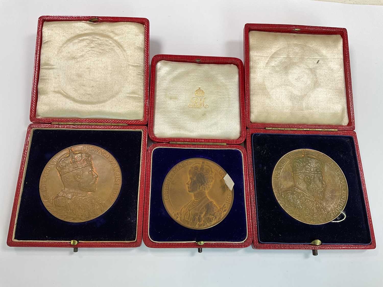 Three commemorative cased Coronation medals including a 1911 George V medal and two 1902 Edward