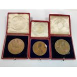 Three commemorative cased Coronation medals including a 1911 George V medal and two 1902 Edward