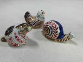 ROYAL CROWN DERBY; a collection of paperweights including a hen, a snail and a beaver. Condition