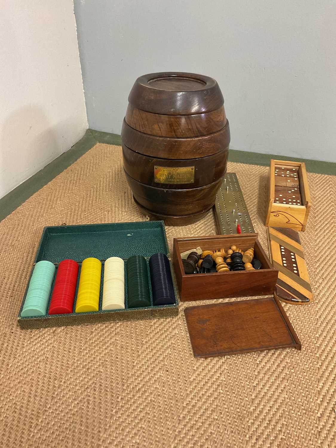 A Remy Martin games barrel and other gaming items including box of wooden dominoes, a box of