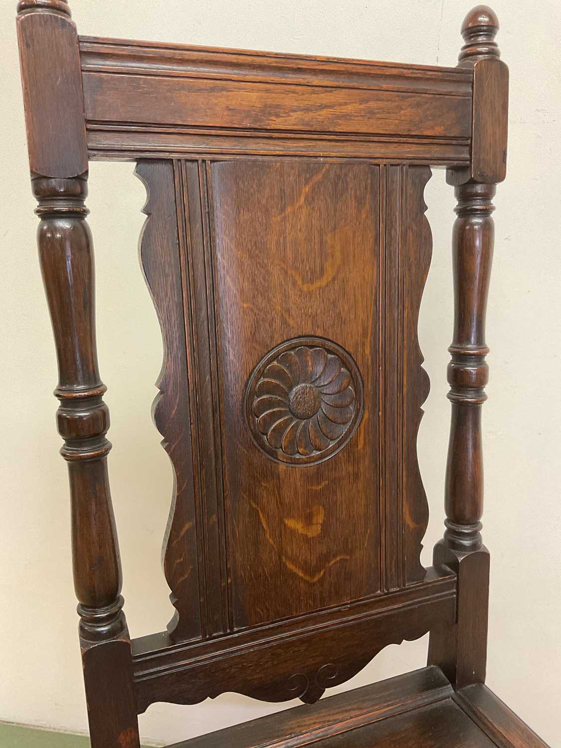 A 19th century oak panel back side chair with panel seat and carved central motif of a flower on the - Image 3 of 4