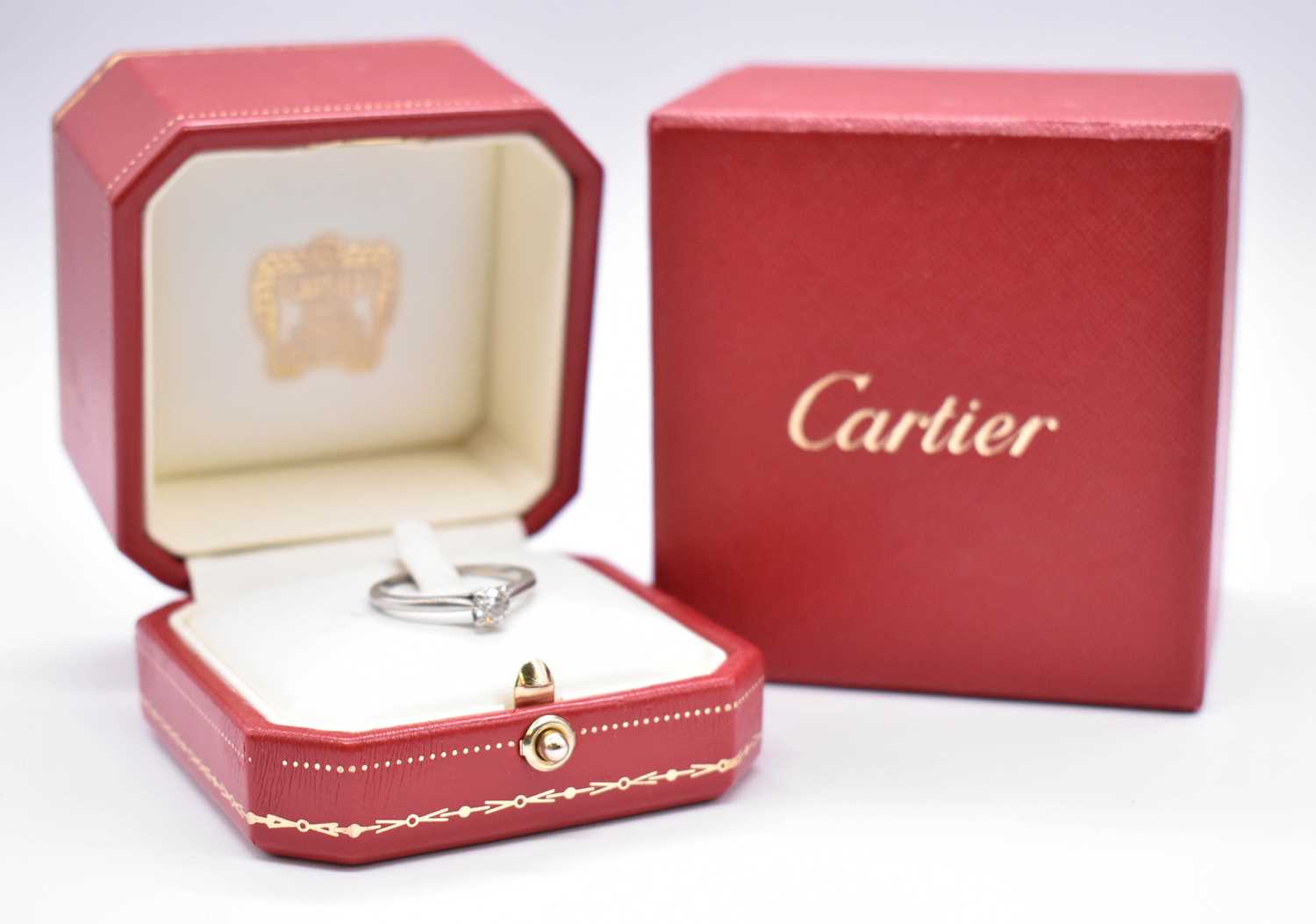 CARTIER; a platinum and diamond solitaire ring, the four claw set round brilliant cut stone weighing - Image 6 of 6