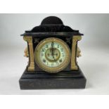 ANSONIA CLOCK CO; a mantel clock in black enamelled iron case with gilded decoration, height 31cm,
