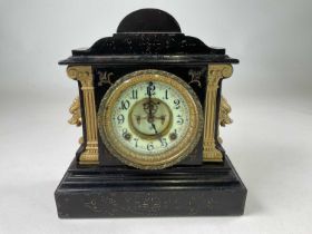 ANSONIA CLOCK CO; a mantel clock in black enamelled iron case with gilded decoration, height 31cm,