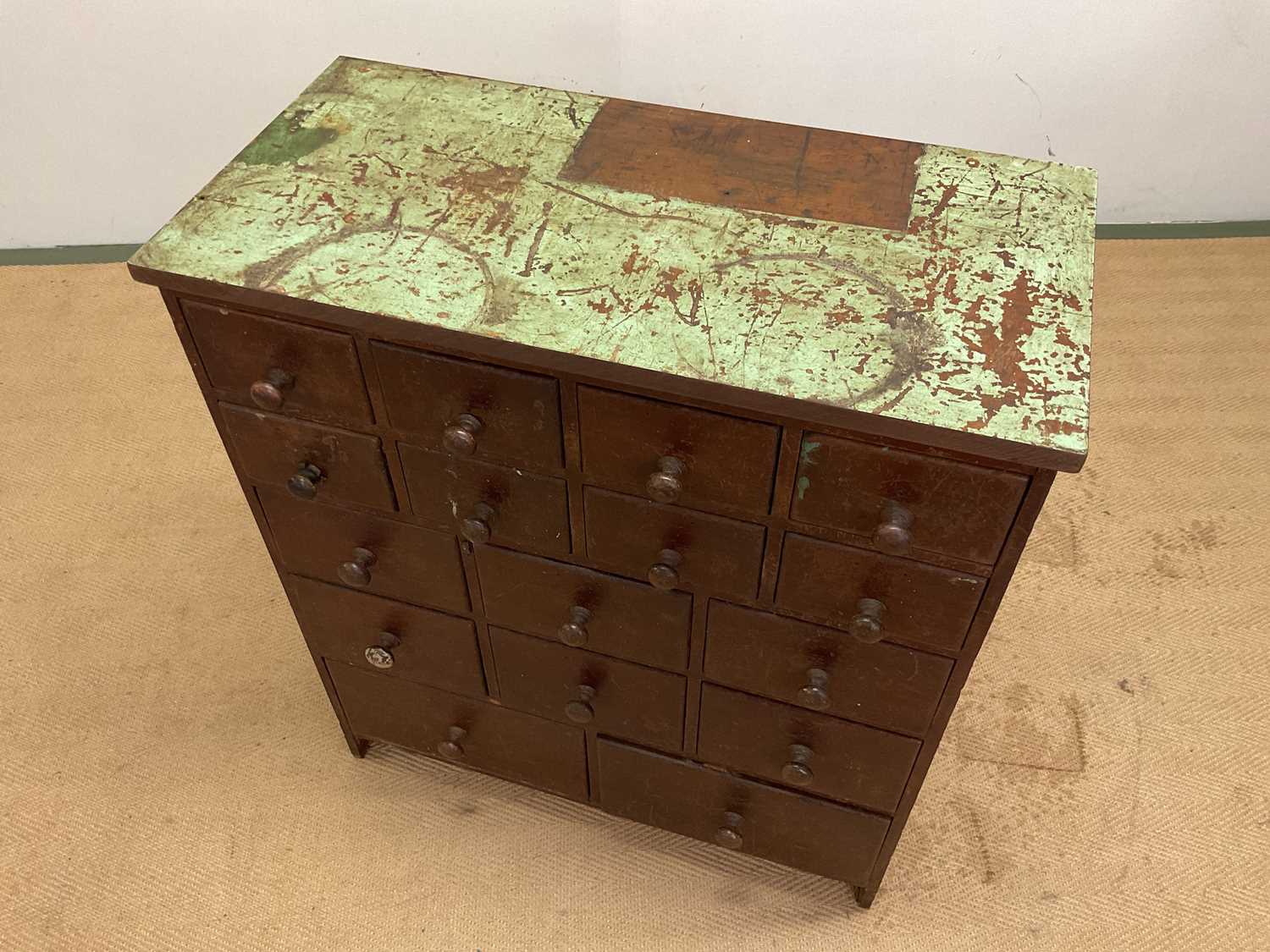 A stained pine workshop cabinet with an arrangement of sixteen drawers, heavily waxed with green - Image 2 of 2