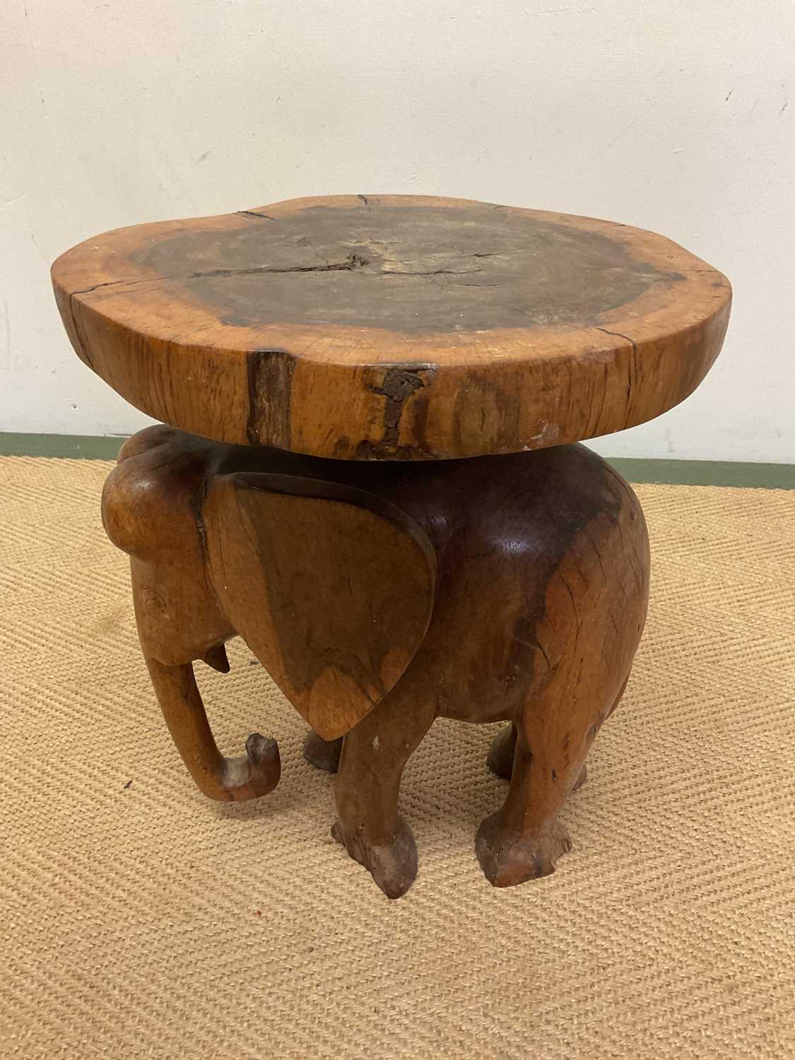 A carved wooden elephant stand, height 39cm, diameter 30cm. - Image 3 of 5