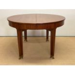 KAARE KLINT FOR RUD RASMUSSEN; a Danish early 20th century circular dining table, with paper label