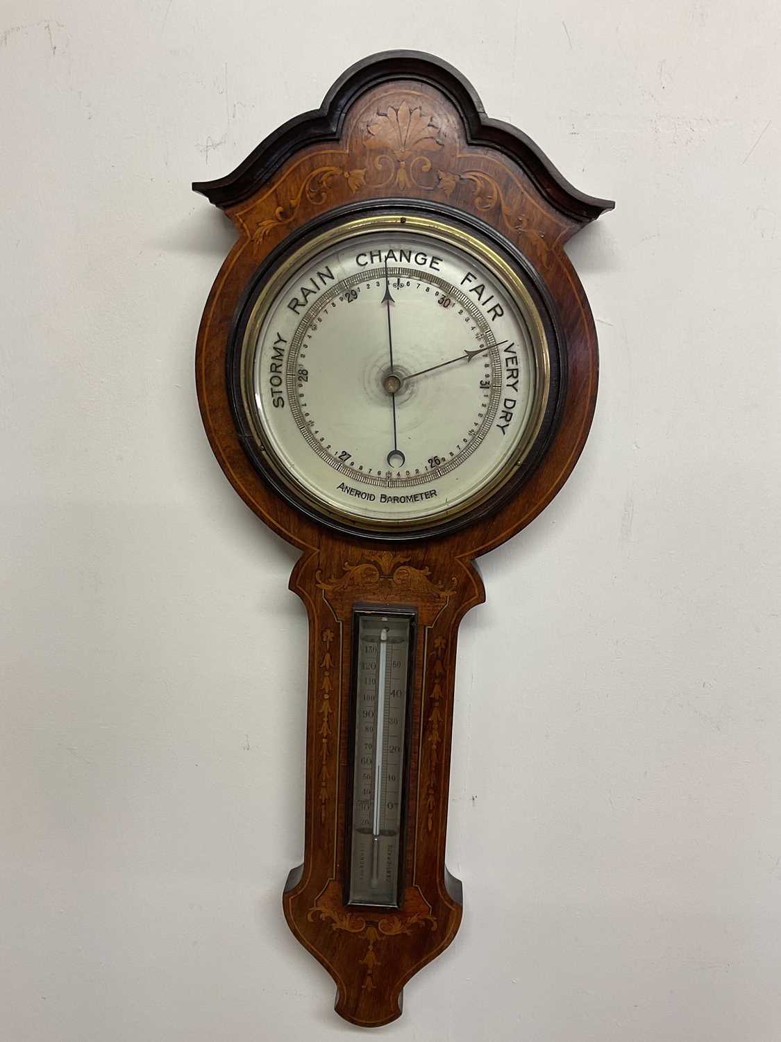 An inlaid mahogany Aneroid Barometer; H; 68cm.