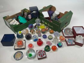 A very large collection of glass paperweights including Caithness examples.