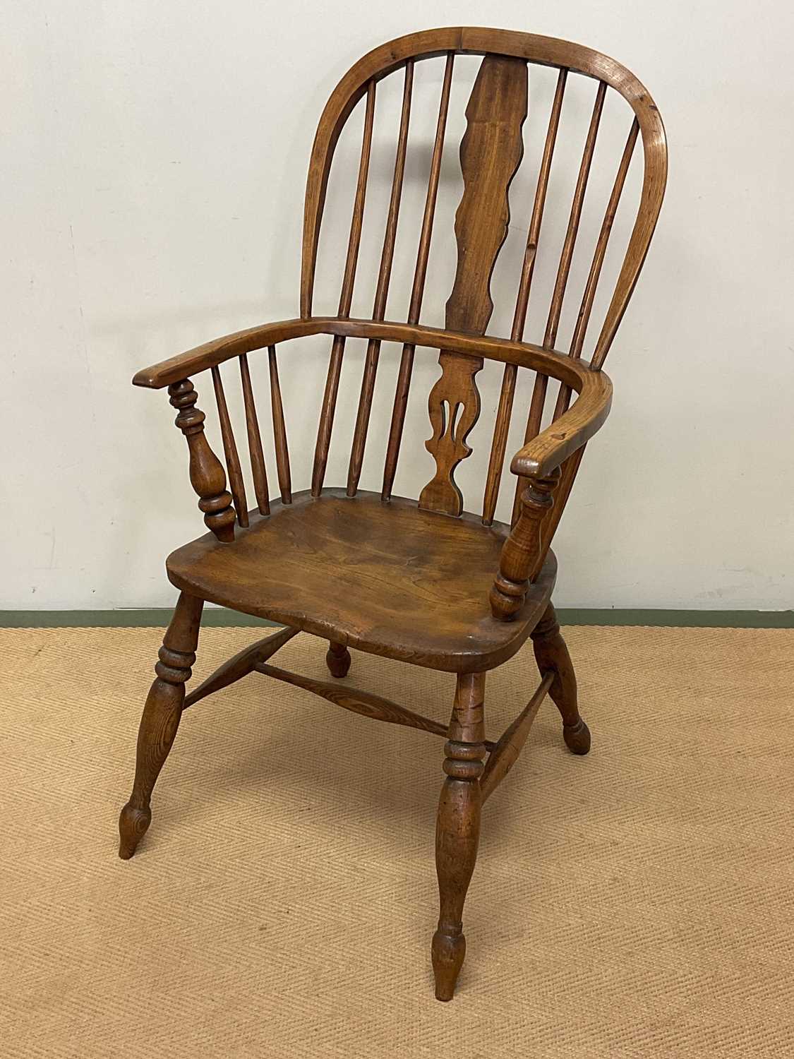 An oak Windsor chair, height 100cm.