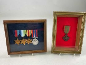 A set of four re-issued WWII medals, framed and glazed, and a single restruck medal in a separate