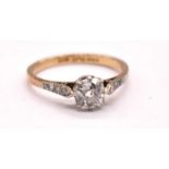 An early 20th century 18ct gold and platinum mounted diamond solitaire ring, the principal cushion