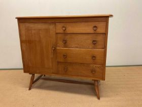 ERCOL; a mid century sideboard with four drawers including a cutlery drawer and a cupboard with