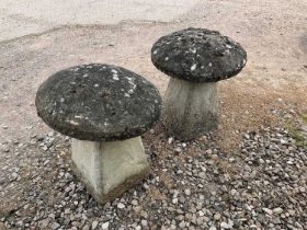 A pair of composite staddle stones, height approx 50cm.