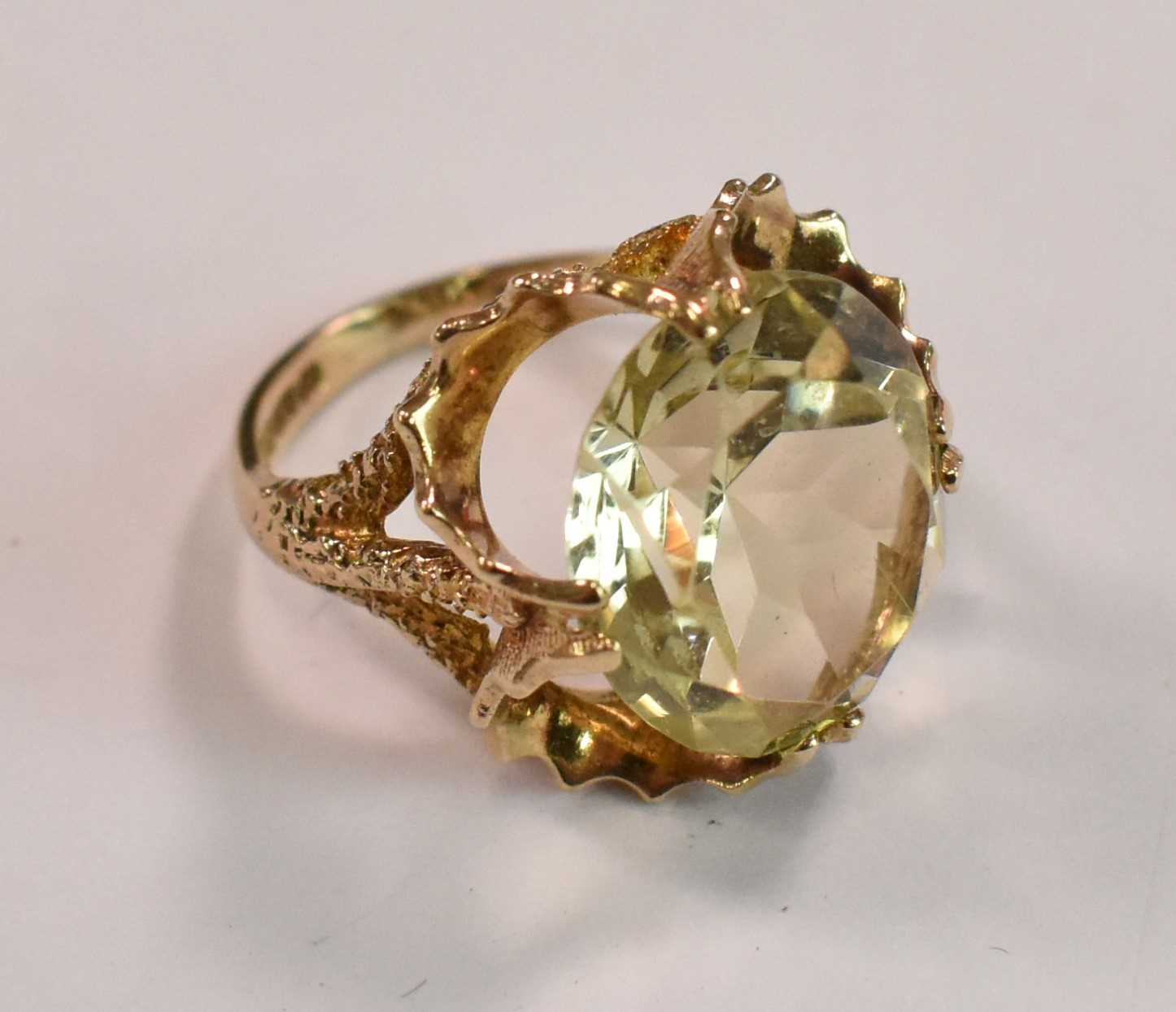 A 9ct yellow gold and citrine dress ring with elborate setting, size H, approx 4.4g.