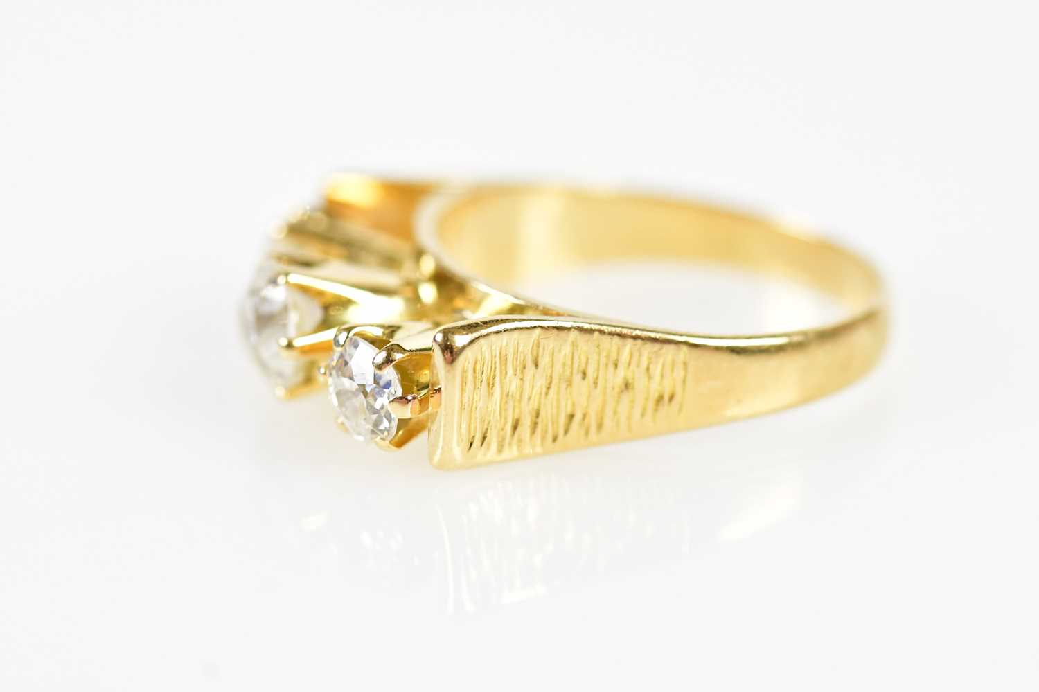 An 18ct yellow gold three stone diamond ring with unusual raised setting formed of three old - Bild 2 aus 6