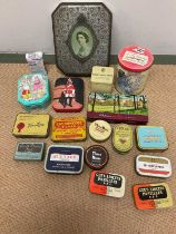 A collection of tins, some vintage, some more modern.