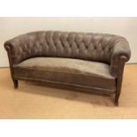 A 1930s Swedish buttonback leather sofa, height 77cm, width 166cm, depth 75cm.