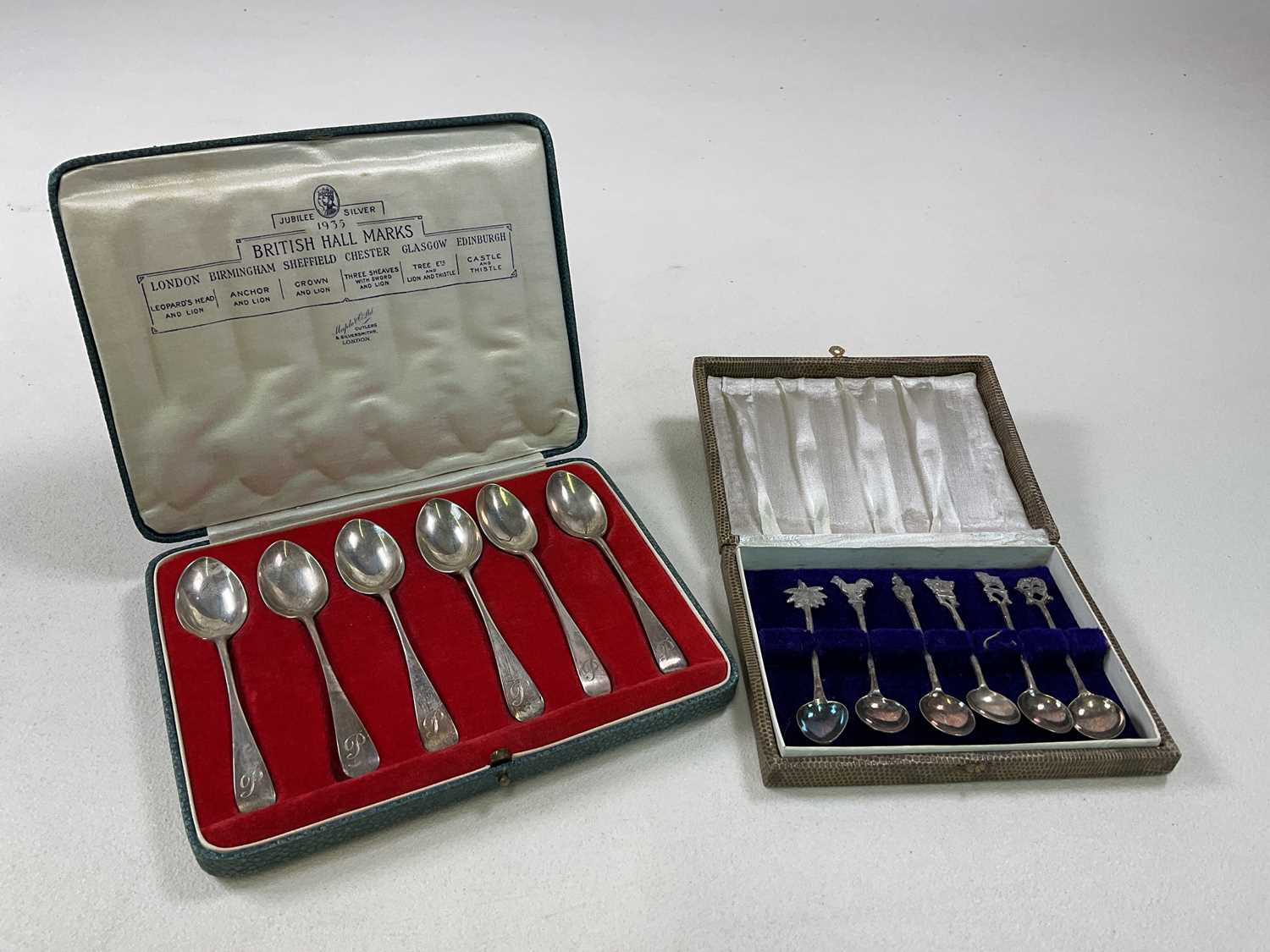 MAPLE & CO, LONDON; cased set of six George V hallmarked silver teaspoons, with 1935 jubilee