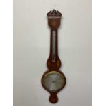 A 19th century mahogany and inlaid wheel barometer with silvered dial inscribed 'D. Luvatti,